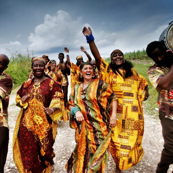 Les Desandann chorus from camag¸ey, performing in a sugarcane field. The chorus has haitian roots.